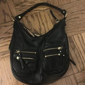 Linea Pelle black leather handbag. Expandable